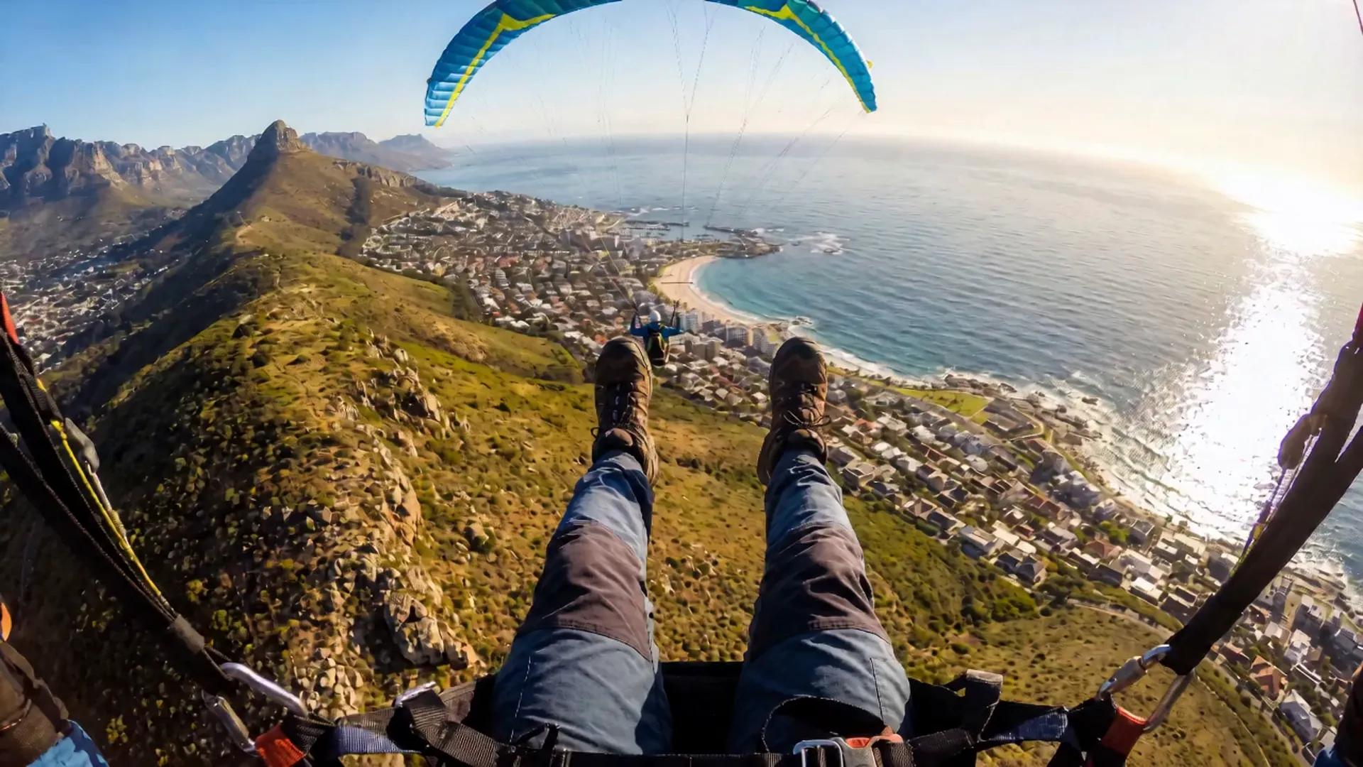 Aerial view over Camps Bay and Clifton beaches from a paraglider